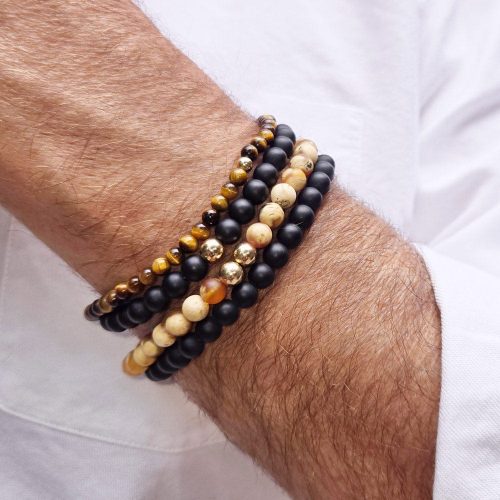 2 men s black onyx beaded bracelets stacked w 2 tiger s eye beaded bracelets white shirt