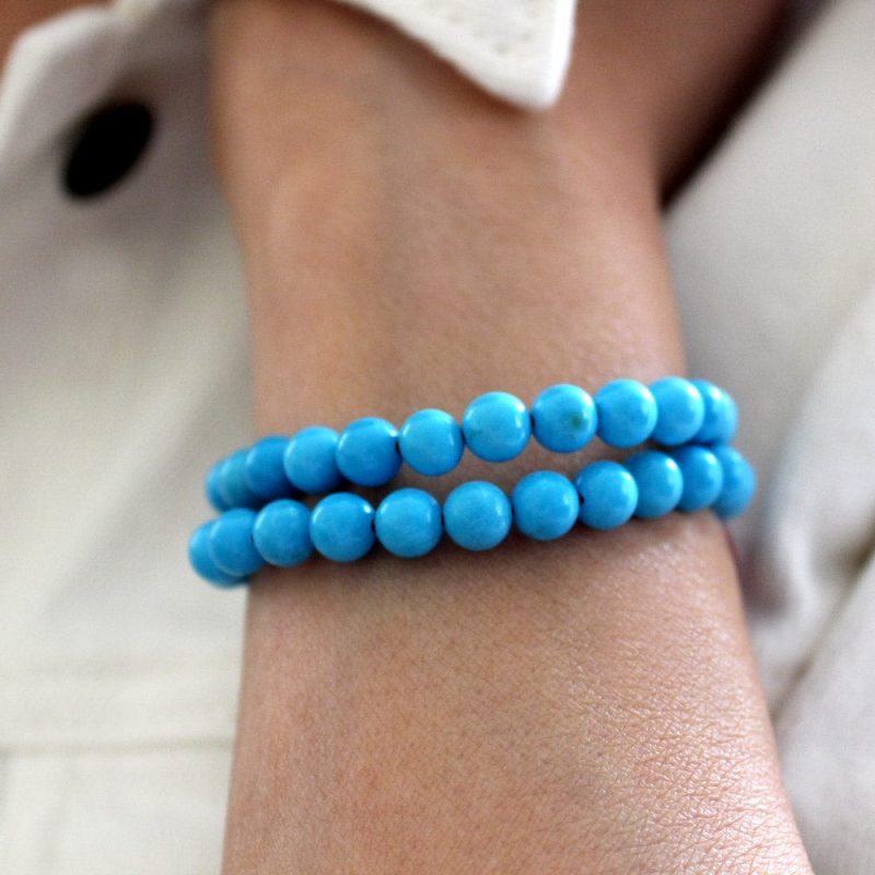 2 turquoise beaded bracelets stacked white