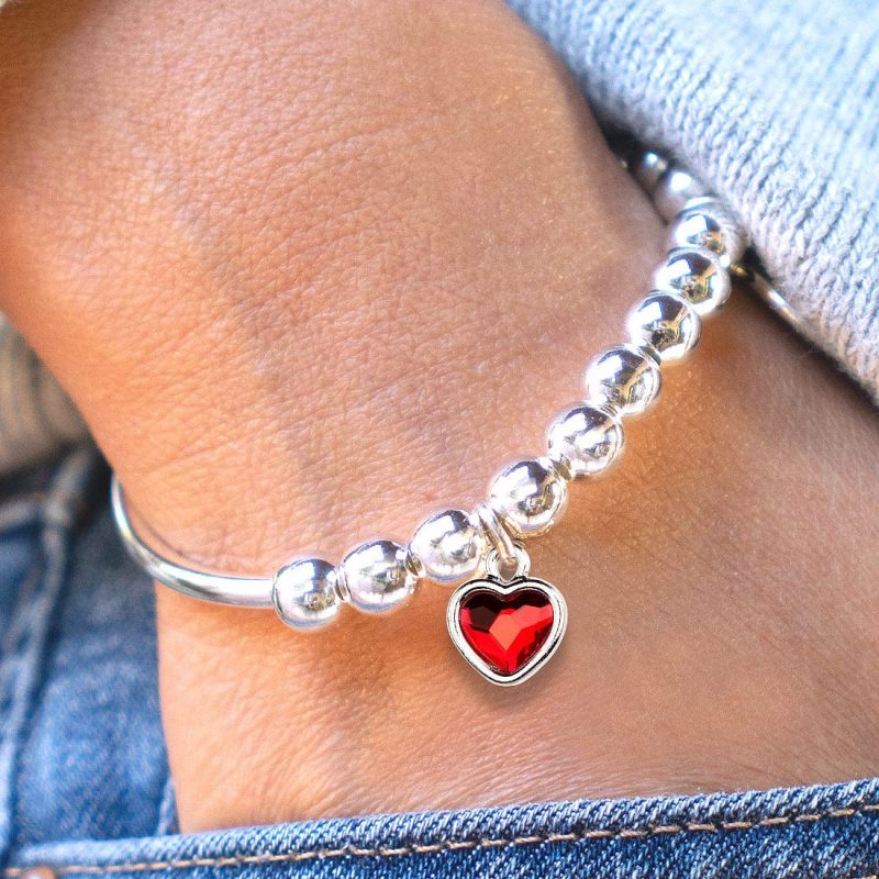 Lori Adjustable silver Bracelet with red crystal Charm denim neutral