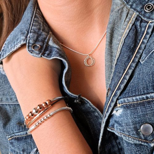 adjustable sterling silver quad circle necklace w Clau rose gold bracelet w pearls and Lim sterling silver bead bracelet denim