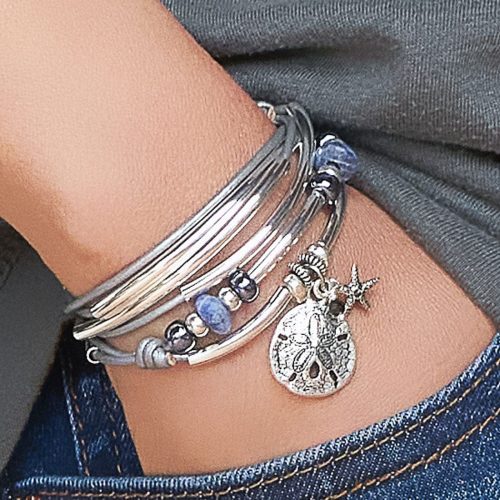 coastal calm silver wrap bracelet with sanddollar charm small starfish charm