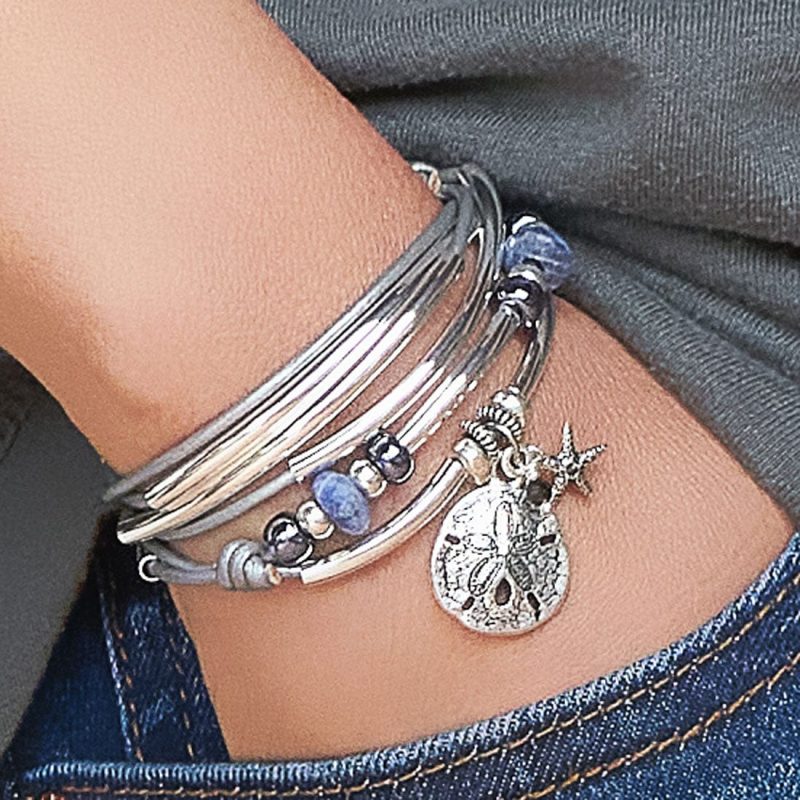 coastal calm silver wrap bracelet with sanddollar charm small starfish charm