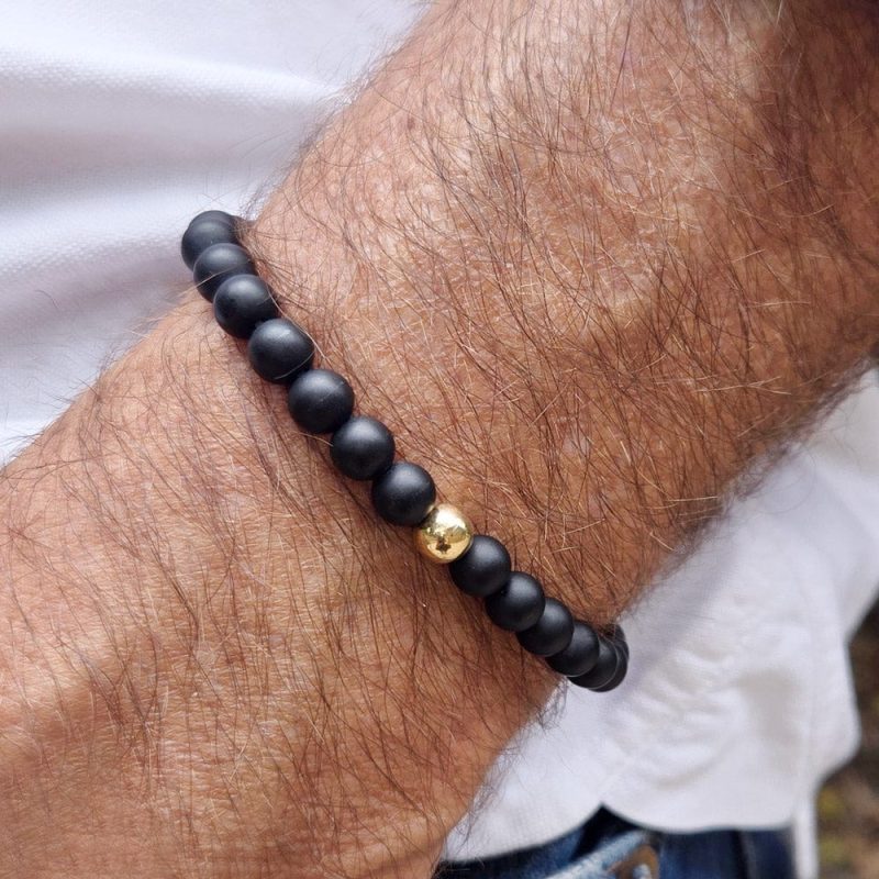 men s black onyx bead bracelet w 14k gold bead white shirt