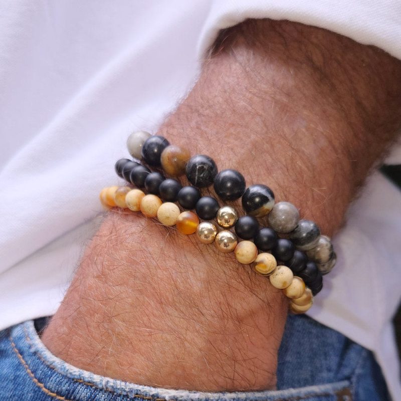 men s gemstone bracelets w black onyx tiger s eye and 14k gold beads with white shirt and denim 3a834387 e7d9 47fb bd2e a6ca0dfb0ccb