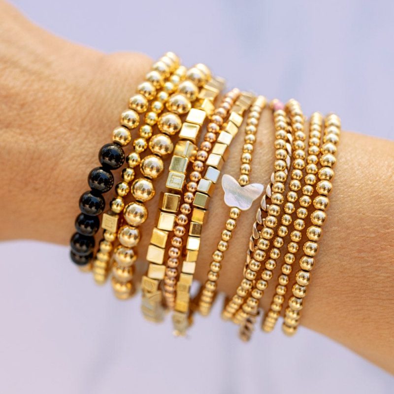 onyx and 14k gold bead stretch to fit bracelet stacked w 3mm 14k gold filled bracelets w crystal butterfly